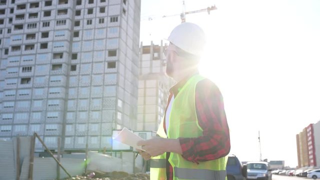 Civil engineer checking work for communication to management team in the construction site
