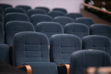 Gray soft velvet chairs in the theater concert hall