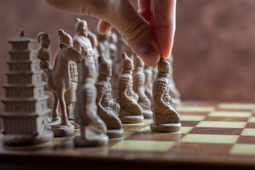 man playing chess game makes his move
