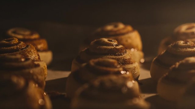 Cinnamon rolls. Baking in oven. Time lapse footage of cooking cinnamon rolls