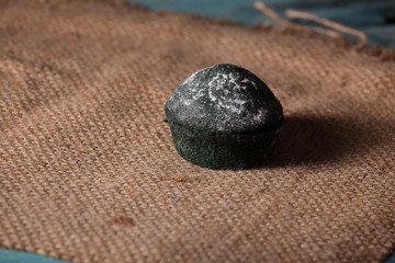 sweet green muffins  on jute with white  sugar powder