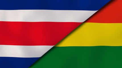 The flags of Costa Rica and Bolivia. News, reportage, business background. 3d illustration