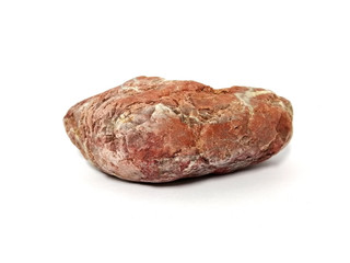 Jasper rock on white background. red stone, Jasper stone is an aggregate mineral commonly used in...