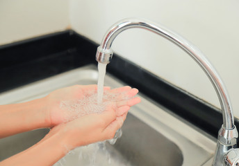 washing hand in sink for cleaning bacteria 