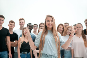 young woman standing in front of a casual group of young people