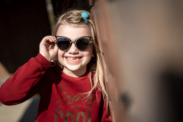 Naklejka premium young girl in glasses and a shuttle sweatshirt