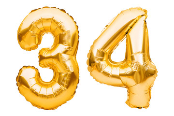 Number 34 thirty four made of golden inflatable balloons isolated on white. Helium balloons, gold...