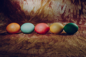 Easter eggs in a row on a vintage background with divorces