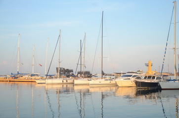 Beautiful yachts near the shore at sunset