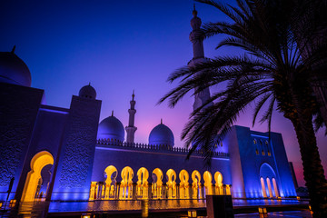 Abu Dhabi, United Arab Emirates - September 5, 2019: Sunset over the Sheikh Zayed Grand Mosque in Abu Dhabi, United Arab Emirates.