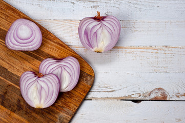 Red onion, lettuce. Health benefits, very rich in vitamins. Background for vegetables and garden plants and cooking.