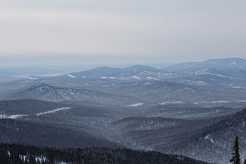 Fototapeta na wymiar View of high mountains in winter
