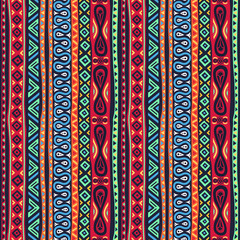 Seamless multicolored ethnic pattern with geometric, floral, decorative and fashion elements. For wallpaper, textiles, souvenirs, printing and prints.