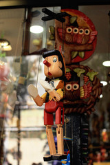 Wooden pinocchio style dolls in a street flea market