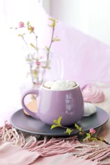 A cup of coffee, meringues, flowering branches of cherry on the windowsill, spring, morning, home rest