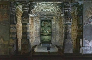 Fototapeta na wymiar Sculptures of Gautama Buddha inside the Caves of Ajanta, an UNESCO world heritage site near Aurangabad in Maharashtra, India