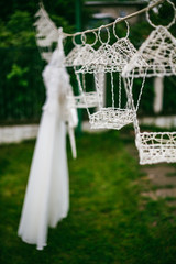 Wedding decor, candles in glass flasks in the forest.