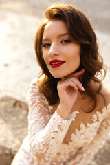 Beautiful stylish bride in lush dress in the park