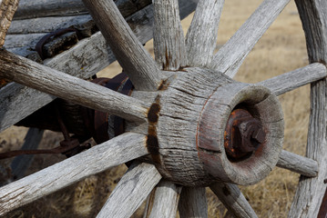 close up of a wooden wheel hub and spokes