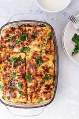 Delicious homemade italian Lasagna with bachamel sauce on gray background. Hot tasty Lasagna with cheese