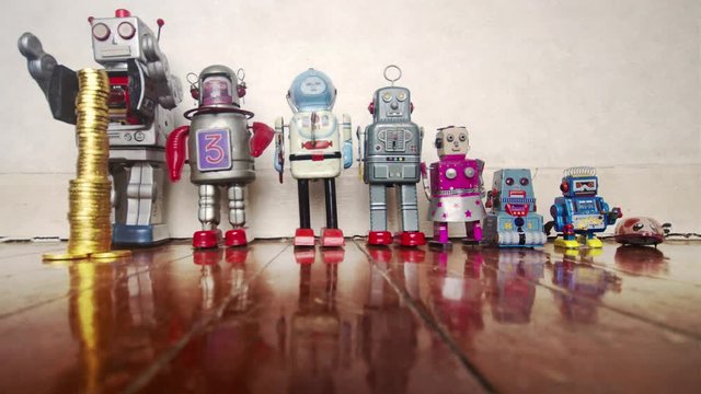 concepts wealth inequality with retro robots and toy gold money 