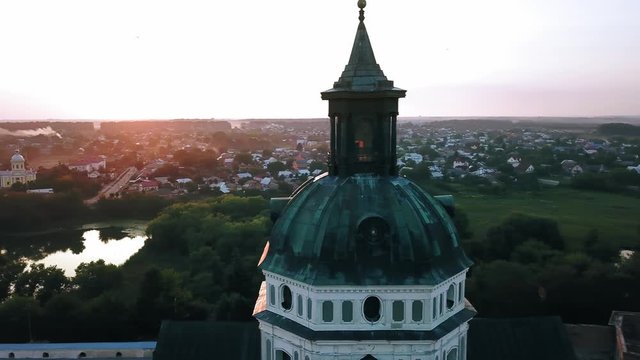 Aerial view of Monastery of the Barefoot Carmelites at sunset, Medieval Catholic ancient fortress in Berdichiv city, Ukraine. Monastery of the Barefoot Carmelites, Aerial survey of Monastery of the Ba