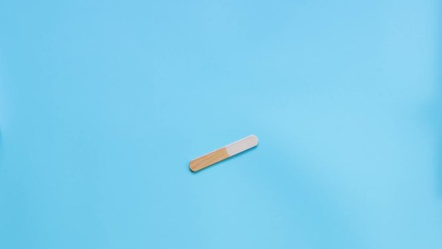 Stop motion of yellow ice cream opening and bite step by step. Retro background color