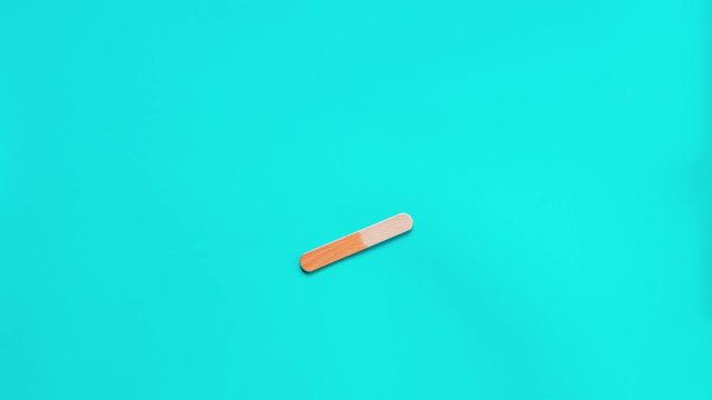 Stop motion of yellow ice cream opening and bite step by step. Retro background color