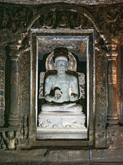 Sculptures of Gautama Buddha inside the Caves of Ajanta, an UNESCO world heritage site near...