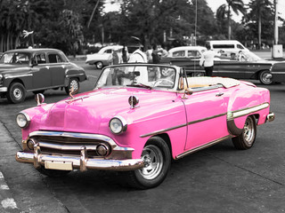 colorkey of vintage pink convertible car on the street of havana cuba