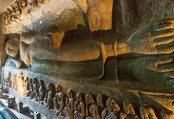 Sculptures of Gautama Buddha inside the Caves of Ajanta, an UNESCO world heritage site near...