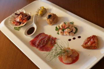 Sea food starter, tuna tartare and pate, cold, served in konoba, Croatia.