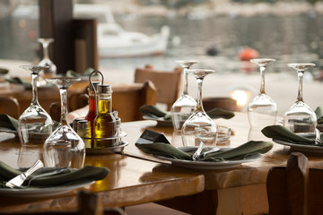 Table in konoba, on island, bay, next to anchorage, Croatia.