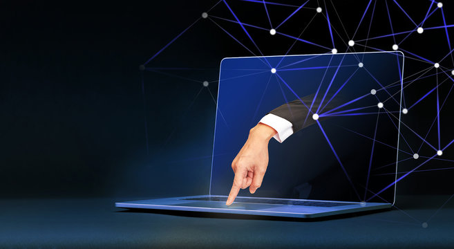 Human hand come out from laptop computer screen and control the computer, Remote Access, Cybersecurity, Machine Learning and ai or Artificial Intelligence concept