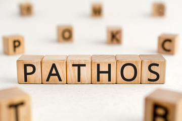 Pathos - word from wooden blocks with letters, a quality causes feelings of sadness or sympathy...