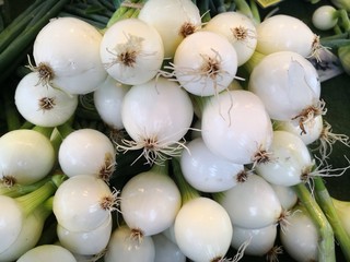 White onions at market stall, full frame image