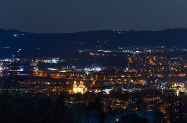 Fototapeta na wymiar City night lights of Kempten with Basilika St. Lorenz. Bavaria, Germany