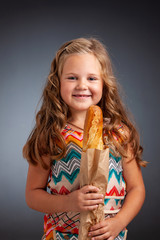 young emotional girl holding a baguette