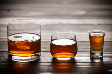 whiskey with ice in glass glasses