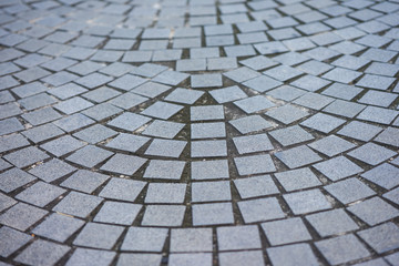 paving stone or tiles in patterns on floor with selective focus