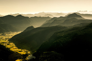 View from the Donnerkogel with layers of Mountains and the valley