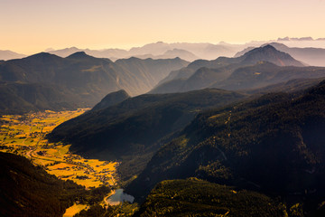 View from the Donnerkogel with layers of Mountains and the valley