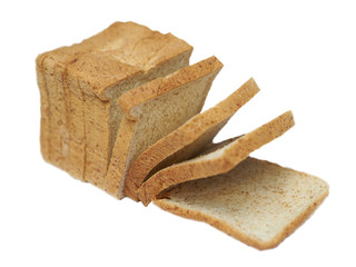 whole wheat bread in roll sliced on white isolated background