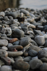 Fototapeta na wymiar The sea coast, strewn with pebbles.