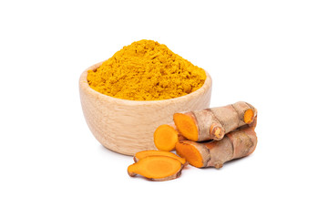 dry Turmeric powder in wooden bowl with rhizome  isolated on white background.
