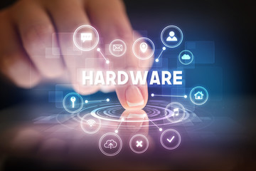 Finger touching tablet with web technology icons and HARDWARE inscription, web technology concept
