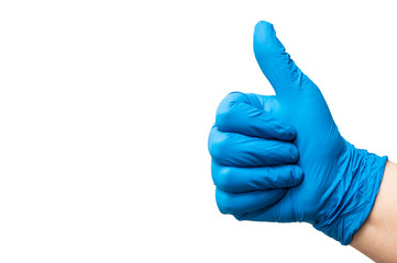 Hand of a nurse with glove making ok sign. Healing concept.