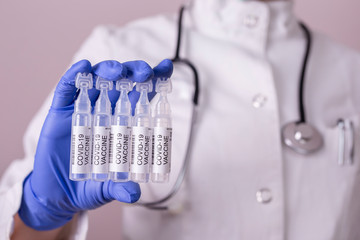 Doctor holding covid-19 vaccines