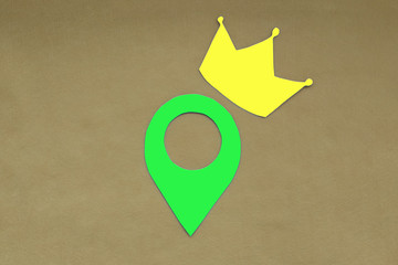 Crown, geolocation sign on a light brown background. Location.