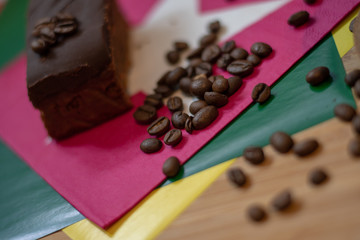 Espresso and coffee beans in background.